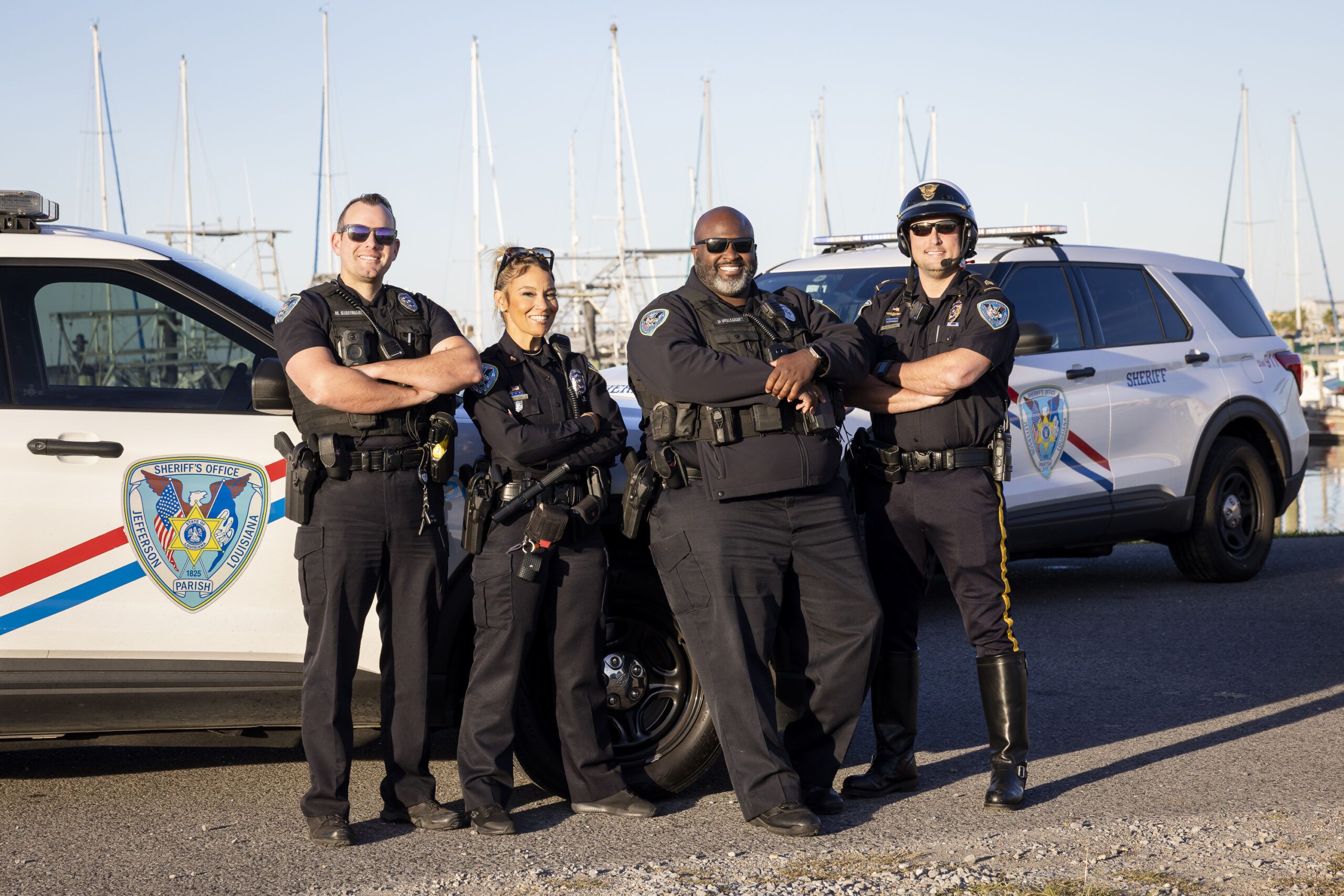 three officers smiling and looking at camera